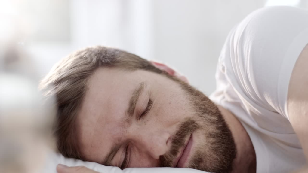 best sleep position to avoid nocturnal emission